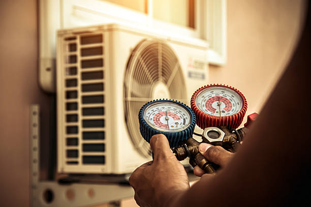 Professional Air Conditioning Service technician working in Fayette, AL